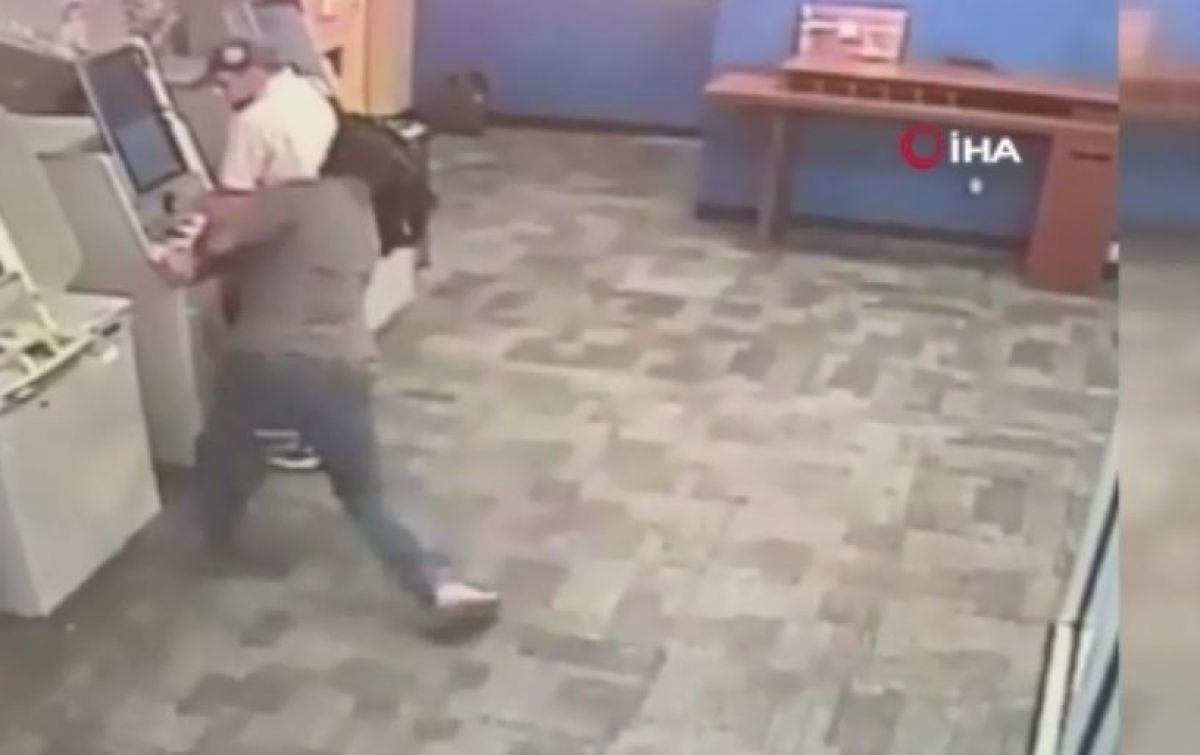 A person in the USA was attacked with an ax while transacting at an ATM #1