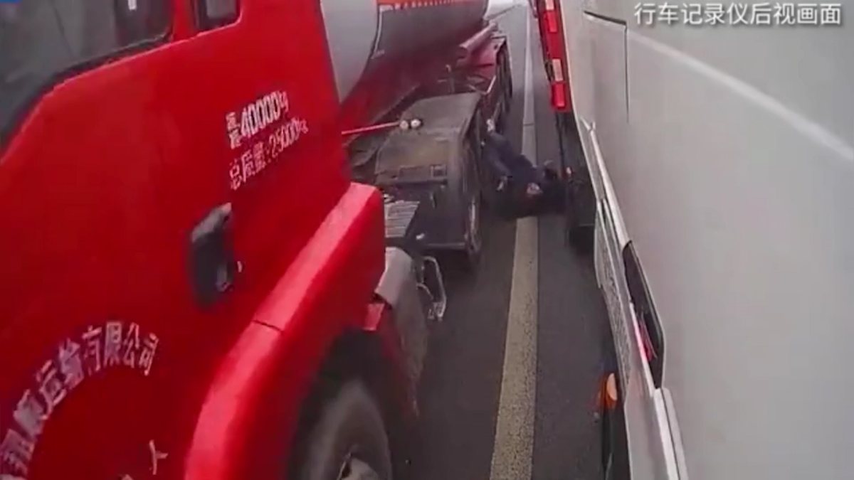 Truck crossing the highway in China crushed the foot of the pedestrian