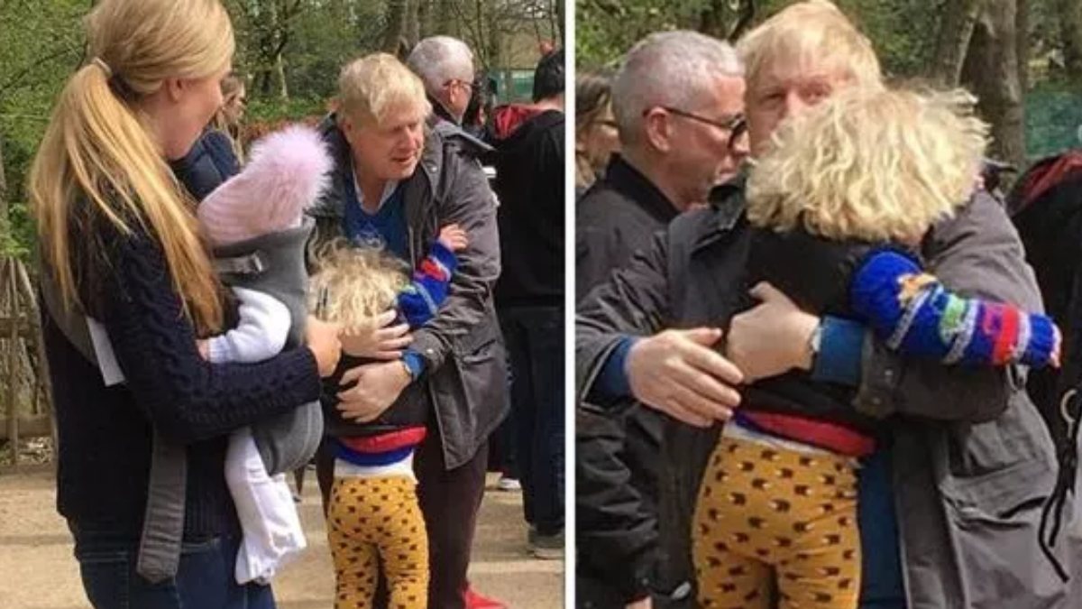 Boris Johnson and his family reflected in the lenses
