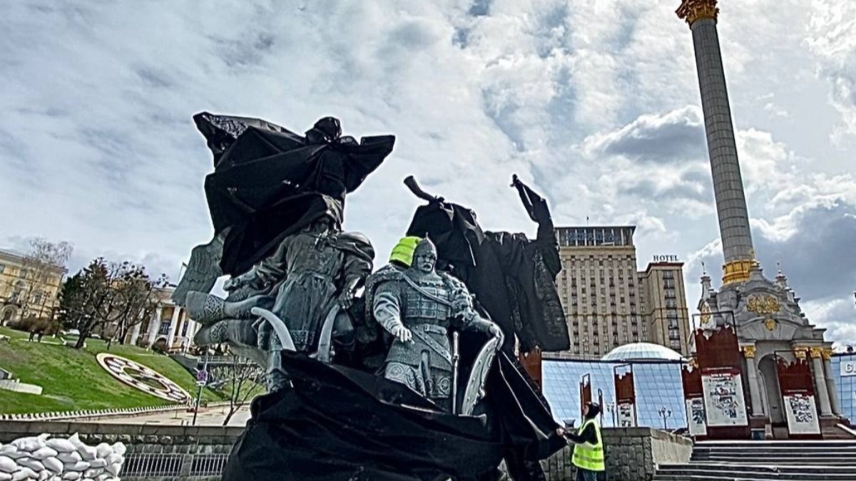 Statue of the founders of Kiev protected with sandbags