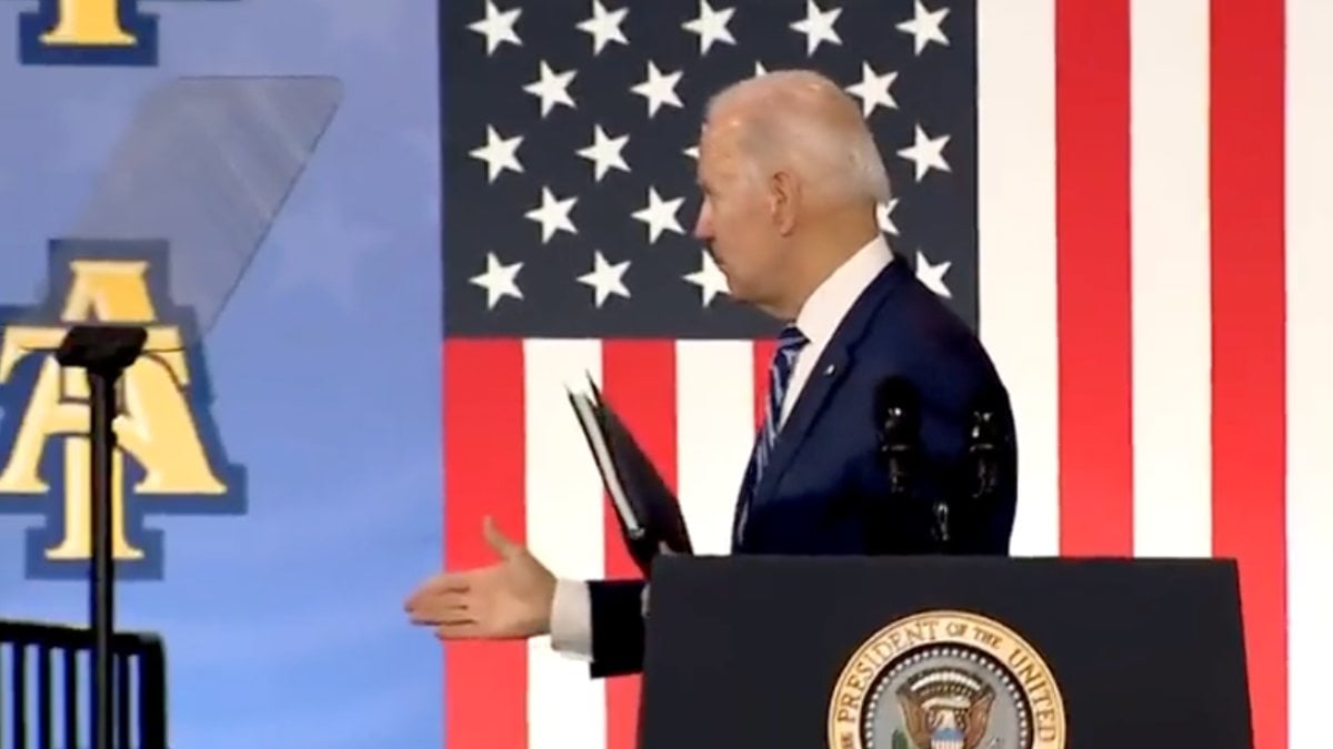 Joe Biden blankly shakes hands