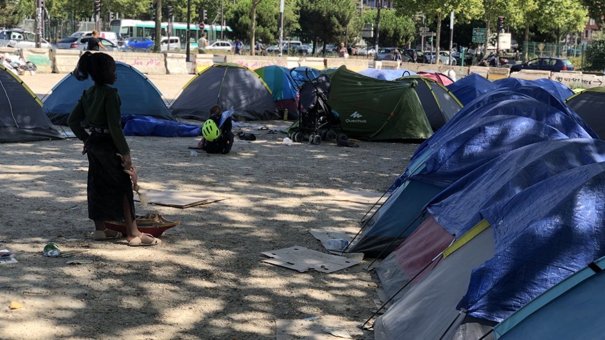 Homeless people living in tents in scorching heat in France