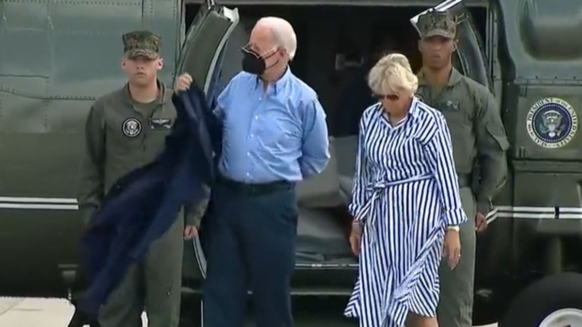Joe Biden, unable to wear his jacket, drops his glasses
