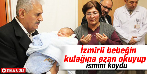 Binali Yıldırım iki günlük bebeğin kulağına ezan okudu