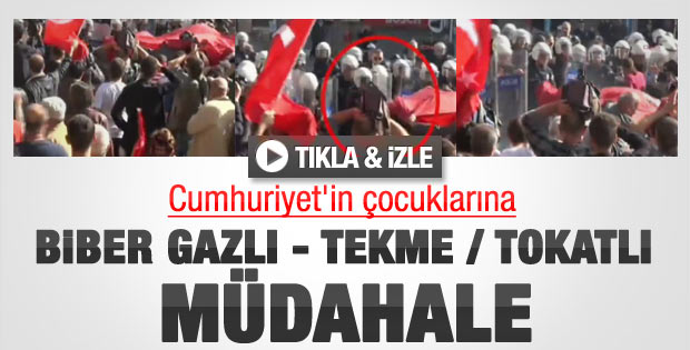 Polis göstericilere tekme attı