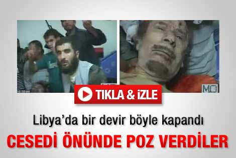 Kaddafi'nin cesedi önünde poz verdiler - İzle