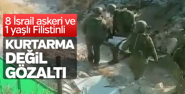 İsrail askerleri yaşlı Filistinliyi sedyede gözaltına aldı
