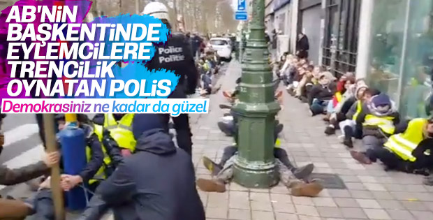 Belçika polisinden göstericilere ters kelepçeli eziyet