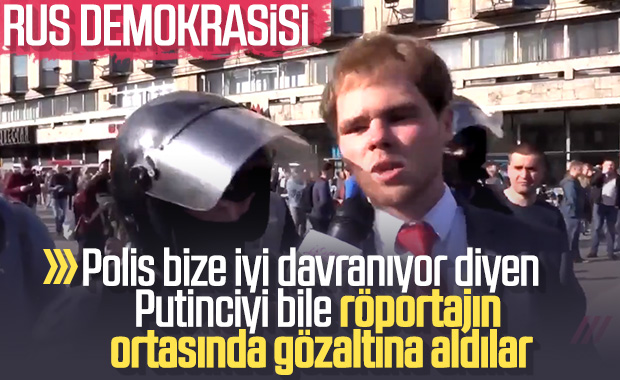 Rus polisi röportaj yapan eylemciyi de gözaltına aldı
