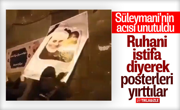 İranlılar Süleymani'nin posterlerini yırttı