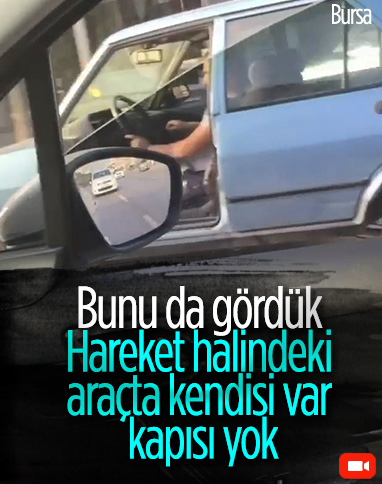 Bursa'da kapısı olmadan trafikte seyreden otomobil