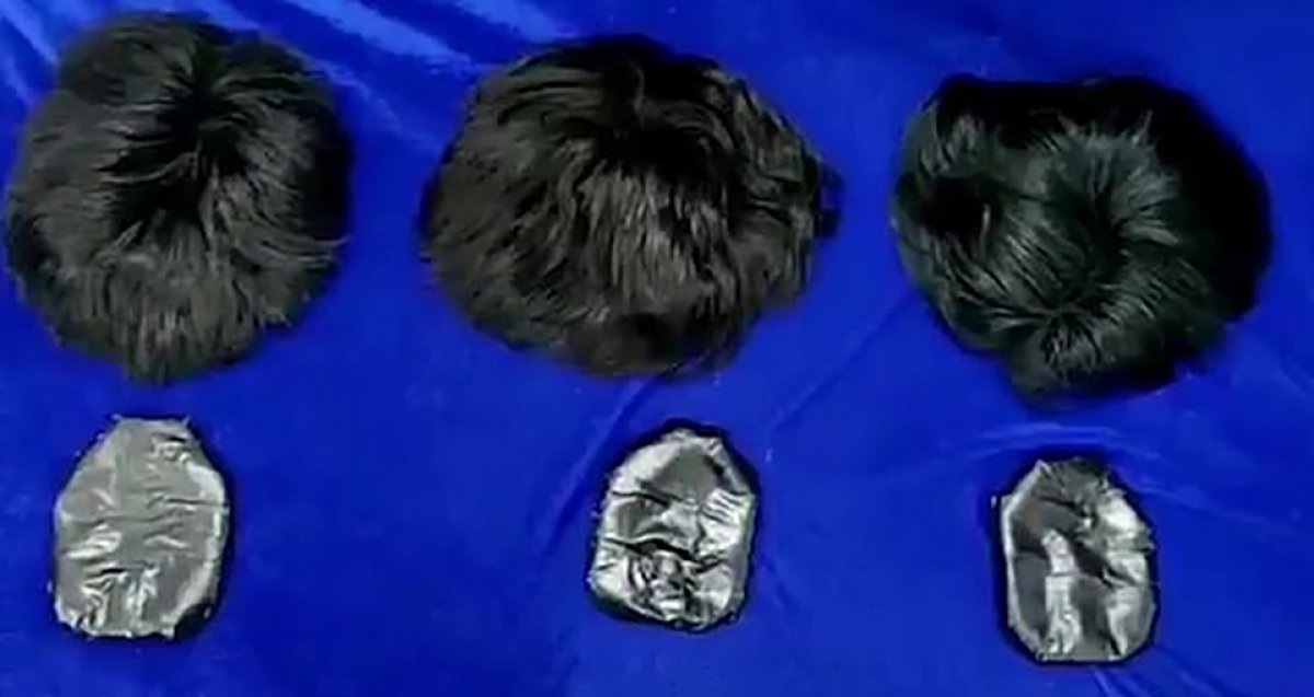 Smugglers in India caught trying to smuggle gold in their wigs #2