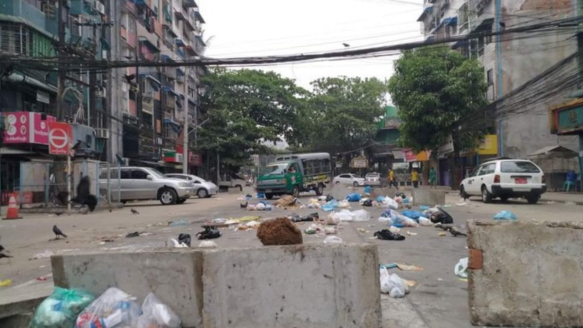 Demonstrators in Myanmar begin dumping garbage