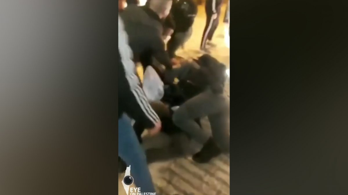 Israeli police beat Palestinian man in front of his children #2