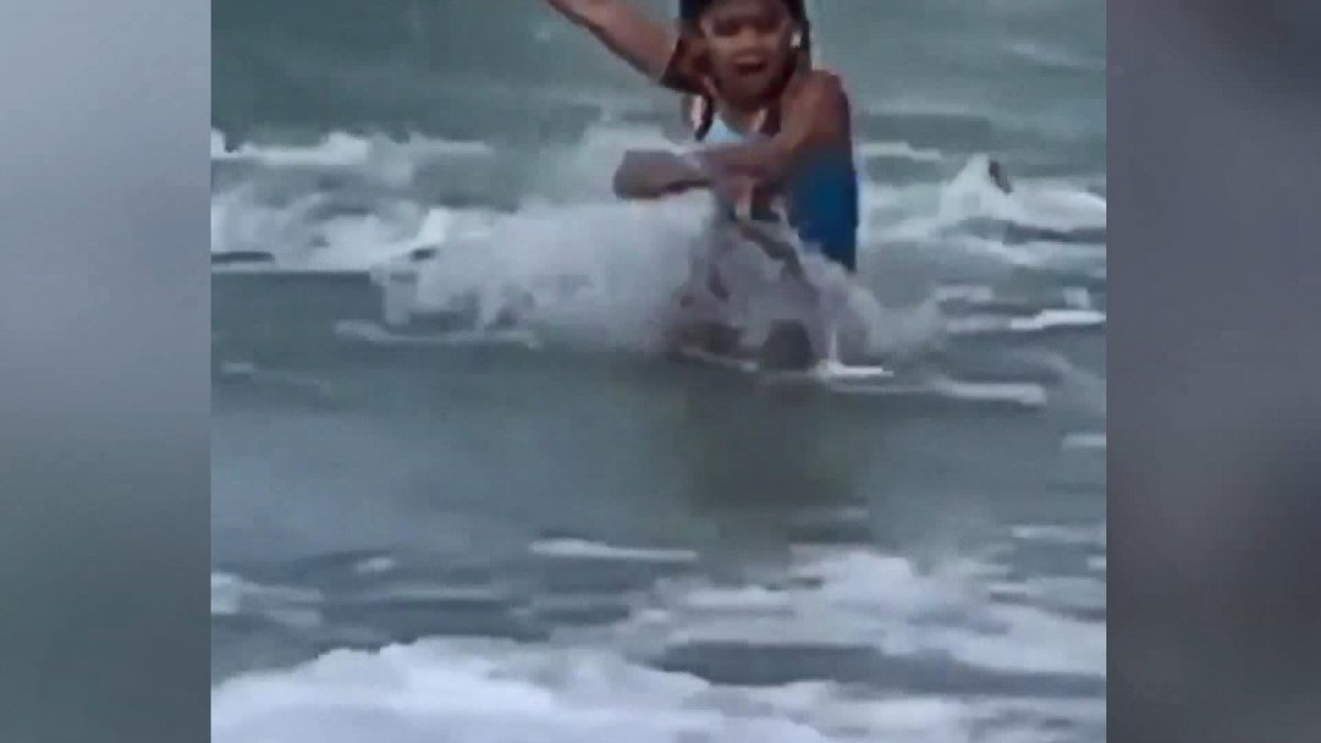Boy running from shark in USA