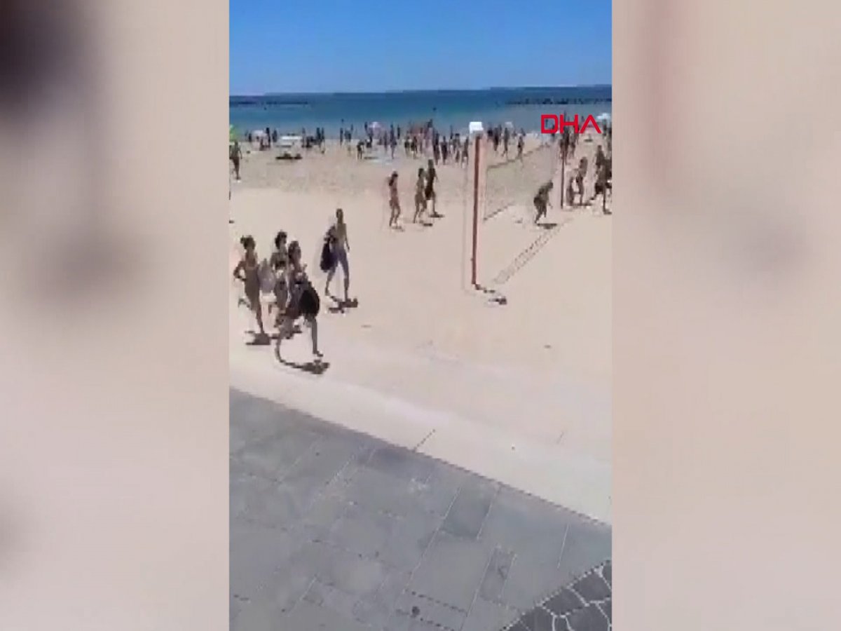 Moments when Israelis on the beach rush to shelter #1 on camera