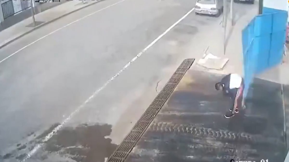 Iron door hit the man bending over in China #1