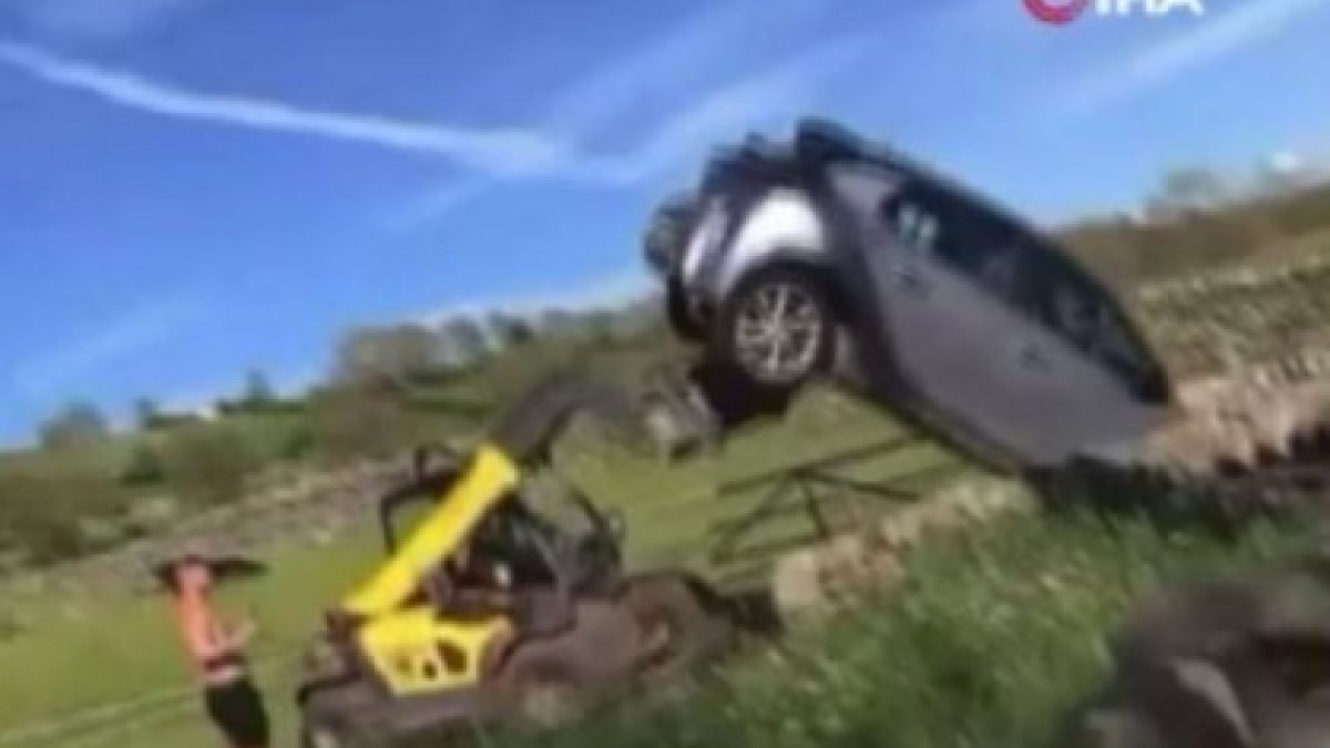 A person in England turned the vehicle in front of his farm over with a construction machine.