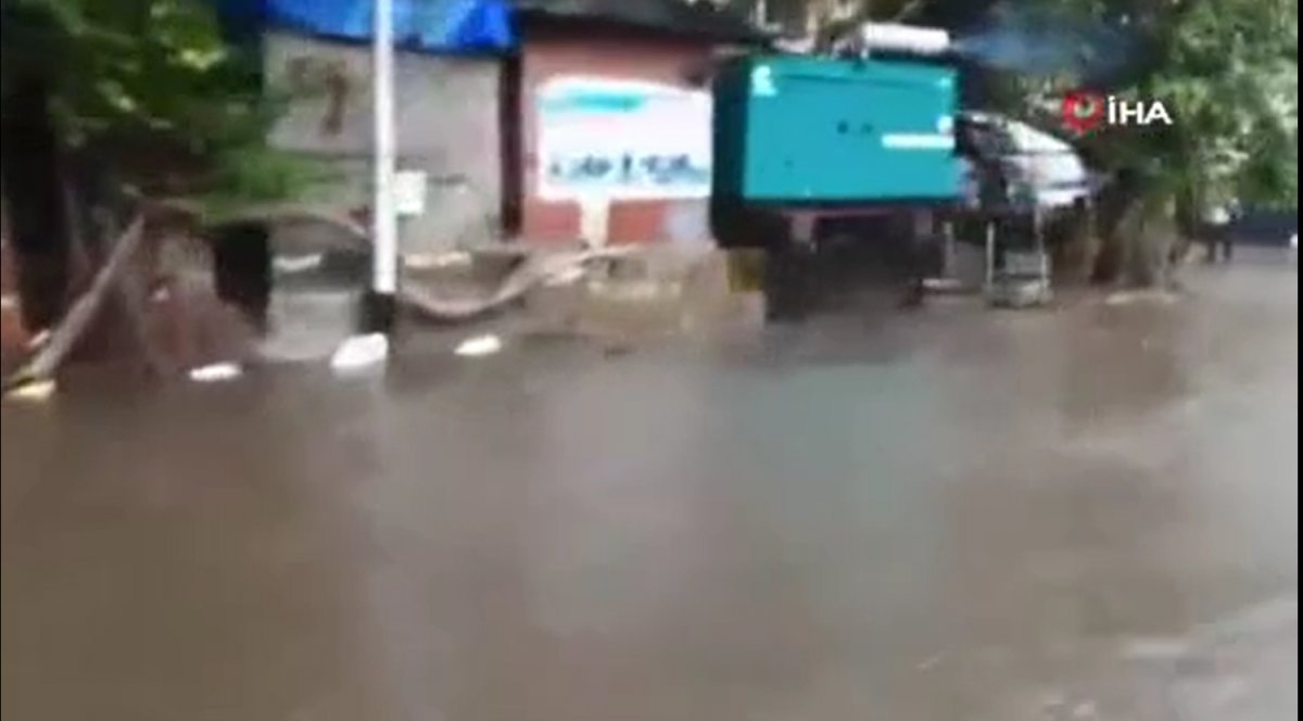 Monsoon rains turn streets into lakes in India #3