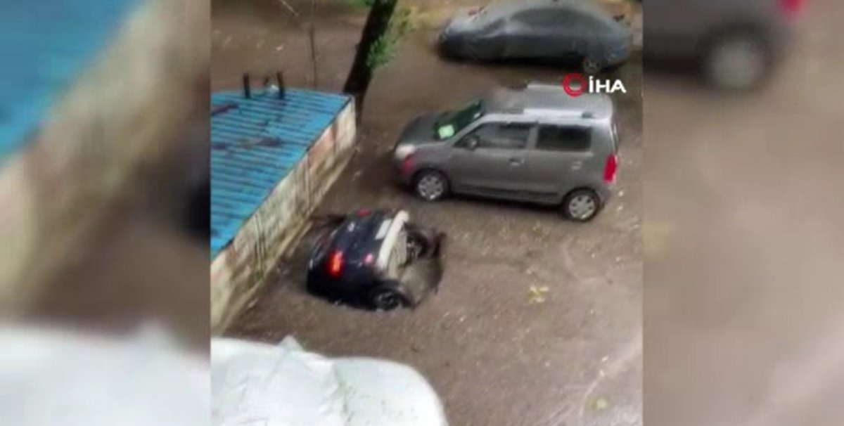 Parked car in India fell into a water-filled ditch #1