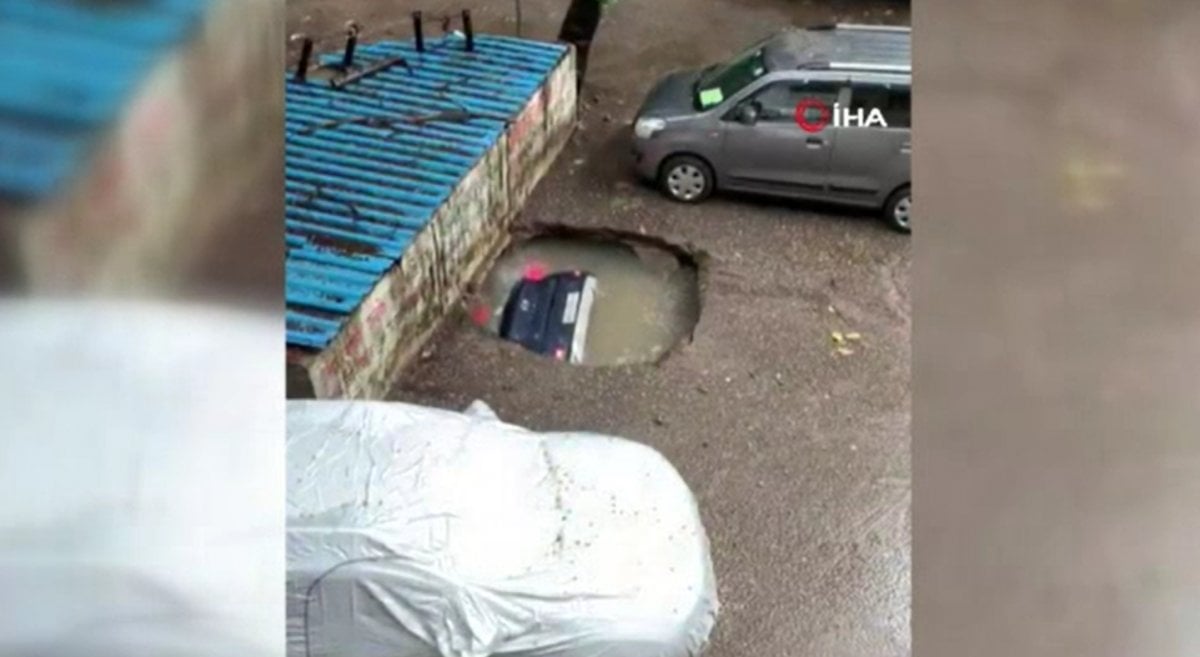 A parked car in India fell into a water-filled pit #3