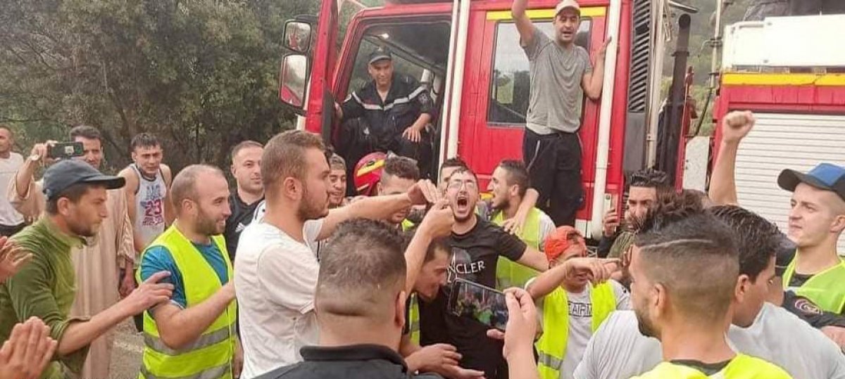 Rain joy during firefighting efforts in Algeria #1