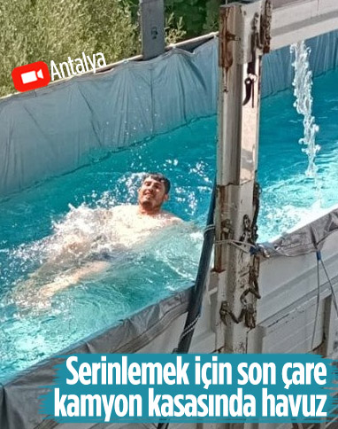 Antalya'da sıcak havadan bunalan çiftçi, kamyon kasasını havuz yaptı