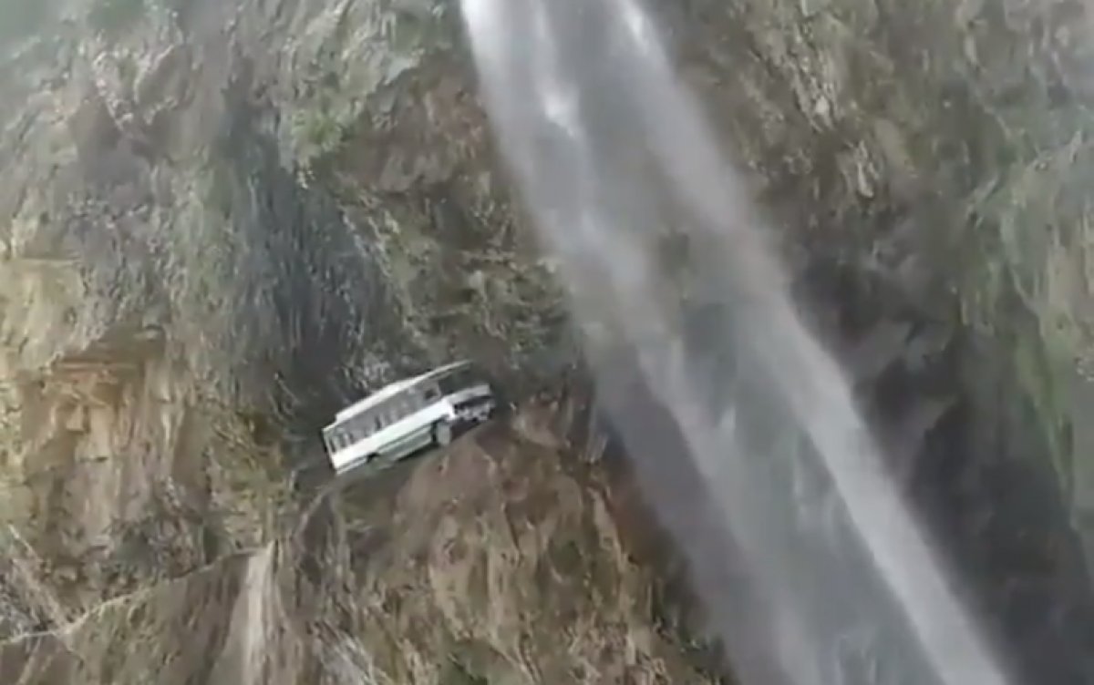 Dangerous road with waterfall flowing over it in India #2