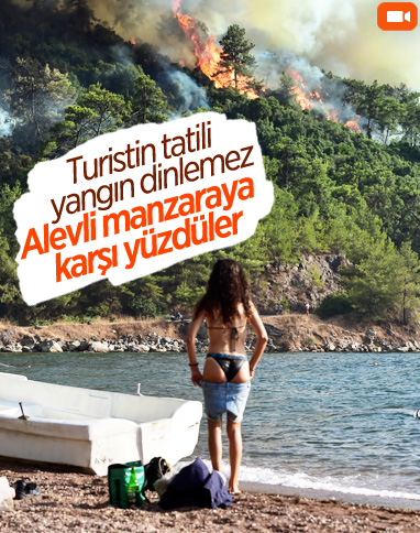 Marmaris’te turistler yangına rağmen yüzdü 
