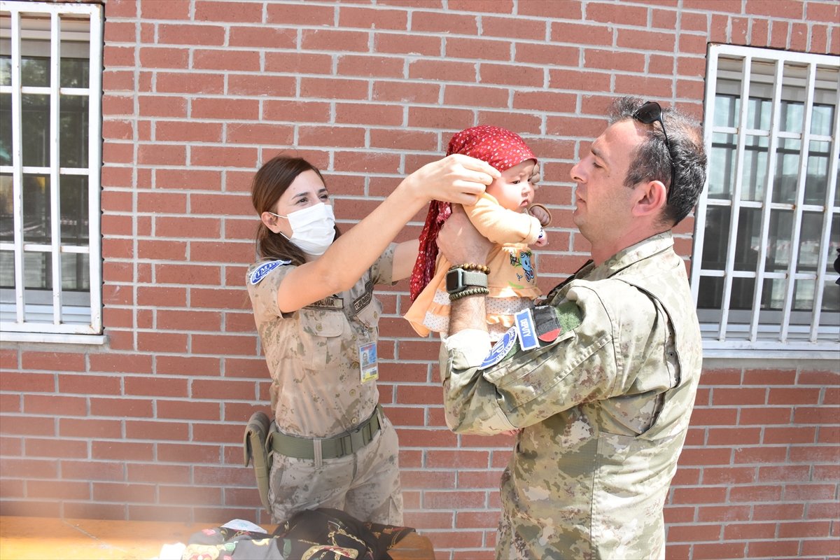 Turkish soldier extends his hand of compassion to baby Hadiya who is separated from her mother in Kabul #4