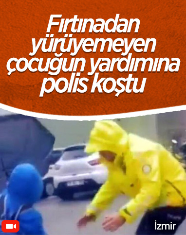 İzmir'de polis, fırtınada yürüyemeyen öğrenciyi kucağında taşıdı