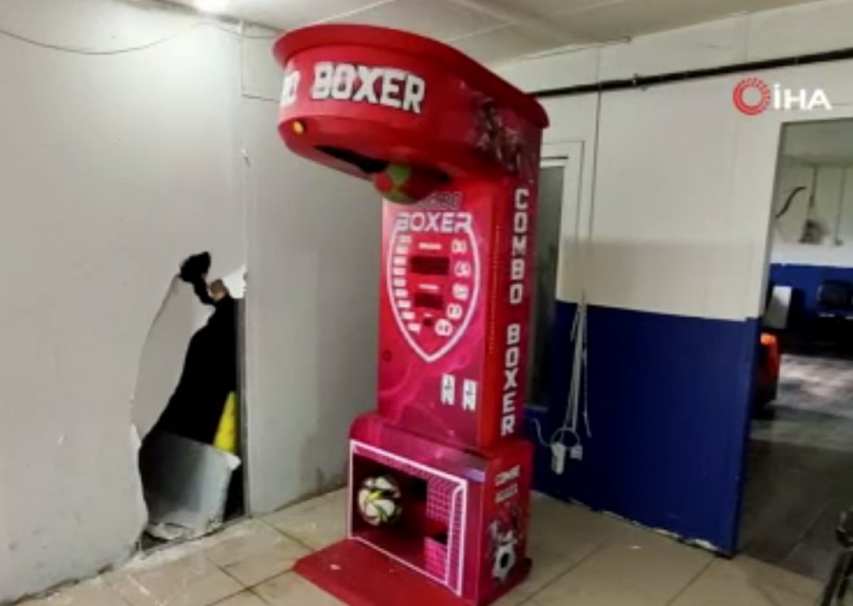 A young man in Istanbul is seen trying to hit the book machine #3