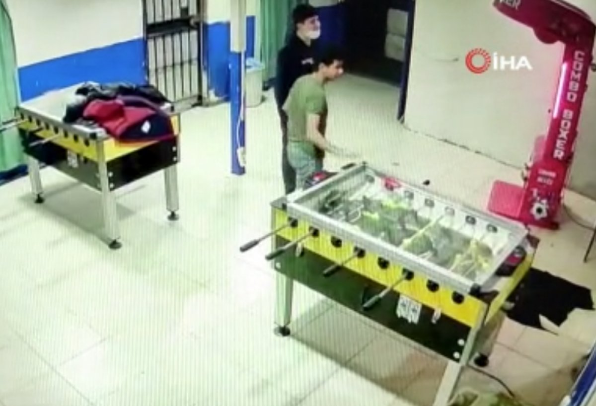 A young man in Istanbul is seen trying to hit the book machine #1