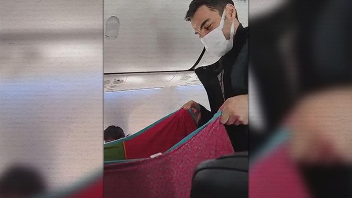 Bingöl uçağında ağlayan bebeği yolcular sallayarak uyuttu #1