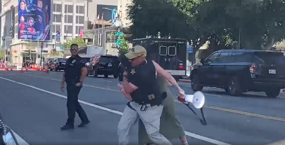 Tough response from the police to the woman protesting Joe Biden #2