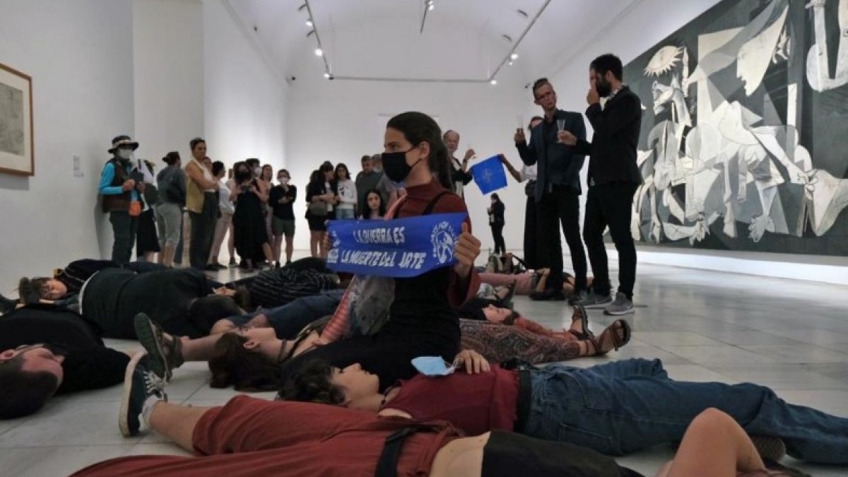 NATO protest in front of Picasso painting, one of the opponents of war, in Spain
