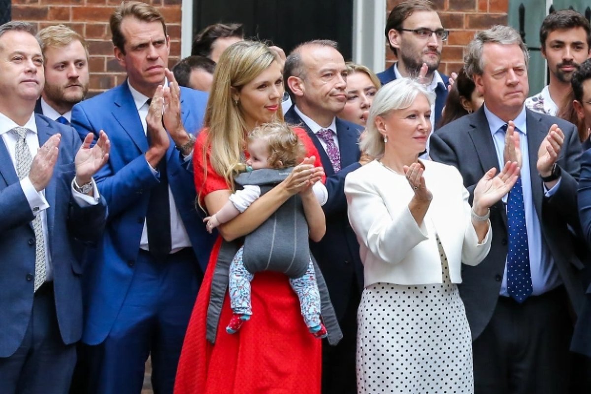 Boris Johnson and his son Wilfred reflected in the lenses #3