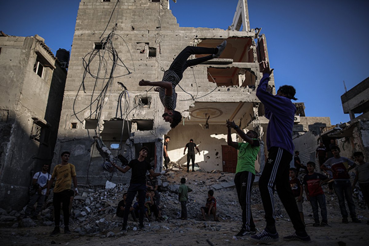 Parkour sport in the rubble of houses destroyed in the Israeli attacks of youth in Gaza #3