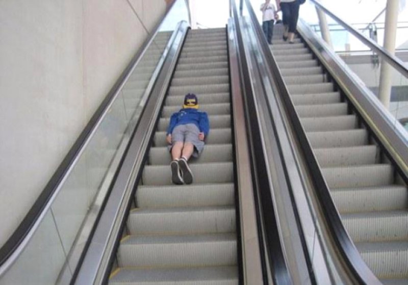 Clown Throwing Pie On Escalator